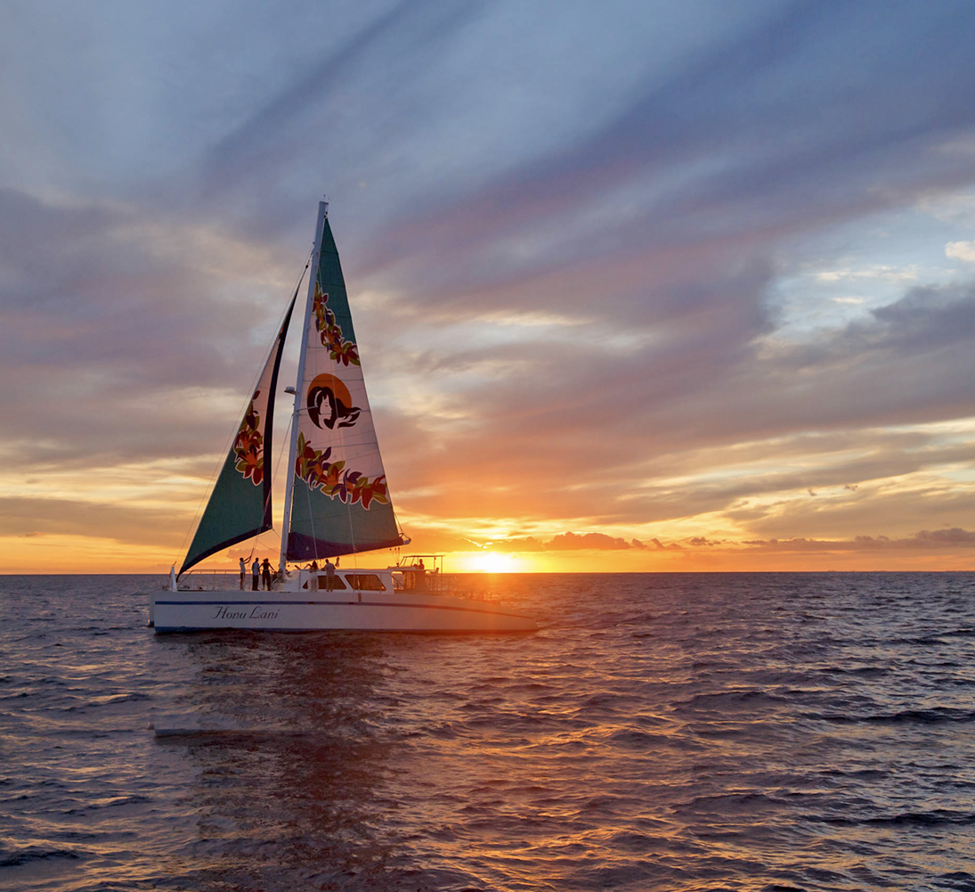 Layer 2 A sailboat on the ocean at sunset.